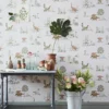 Whimsical 'Classic Dino' wallpaper with delightful dinosaur sketches in a natural setting, ideal for creating an imaginative and playful nursery or children's room.