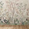 Enchante' wallpaper featuring a delicate and sophisticated garden scene with various birds amongst blooming florals, embodying the enchantment of nature in interior design.