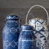 Set of blue and white hand-painted baskets, showcasing intricate patterns and golden accents, blending functionality with artisanal beauty.