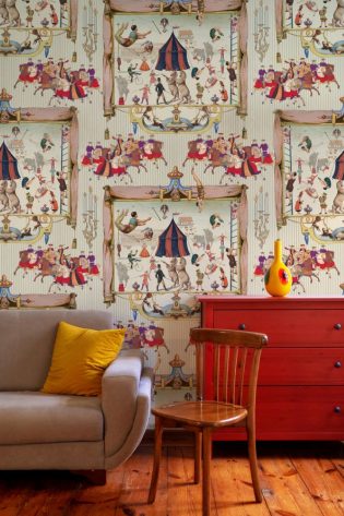 Coliseum-themed wallpaper with animated depictions of ancient festivities, complementing the vivid colors of a room with eclectic decor.