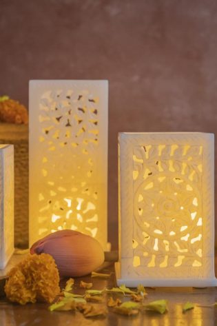 Marble Tingle Candle Stands with patterned luminance, providing a modern yet warm ambiance, ideal for enhancing the charm of any interior decor.