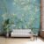 Elegant wallpaper inspired by Van Gogh's Almond Blossom painting, with beautiful flowering branches against a soft blue backdrop, adding a touch of artistic serenity to the room.