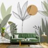 Contemporary Floral Leaves wallpaper featuring stylized plant illustrations in muted tones, creating a serene and stylish backdrop for a green velvet sofa.