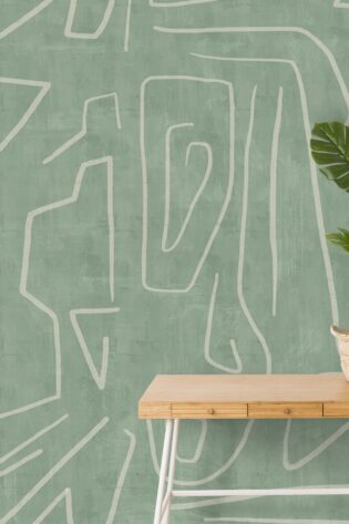 Wallpaper with abstract, linear designs in a calming green shade, creating an invigorating backdrop for a simple wooden bench and lush houseplant.